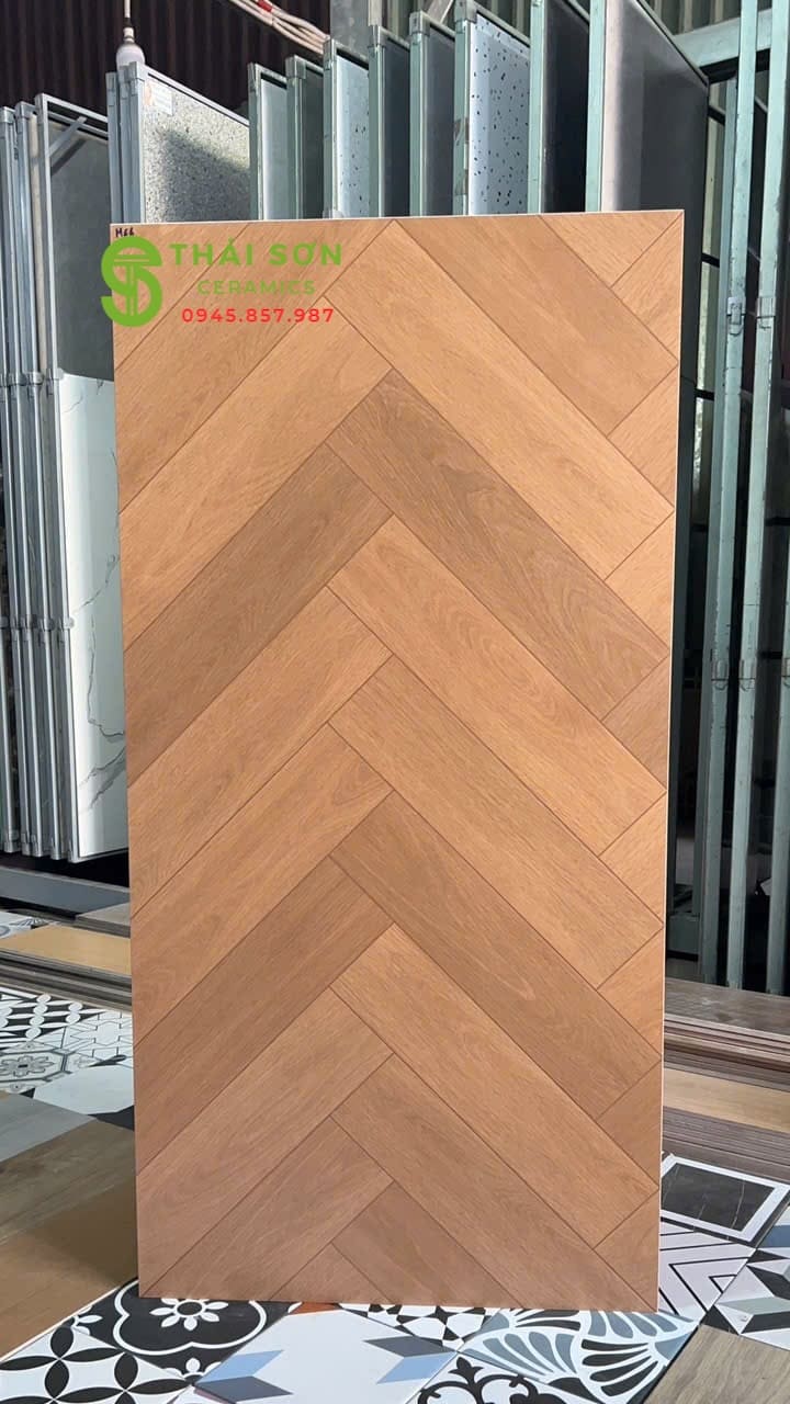Gạch vân gỗ xương cá 60x120 trung quốc lát nền tông màu nâu vàng ấm