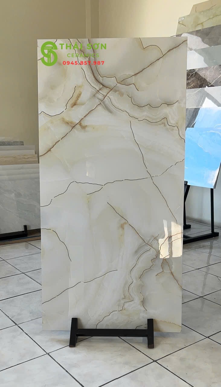Gạch lát nền 60x120 trung quốc bóng kiếng vân đá khắc kim vàng