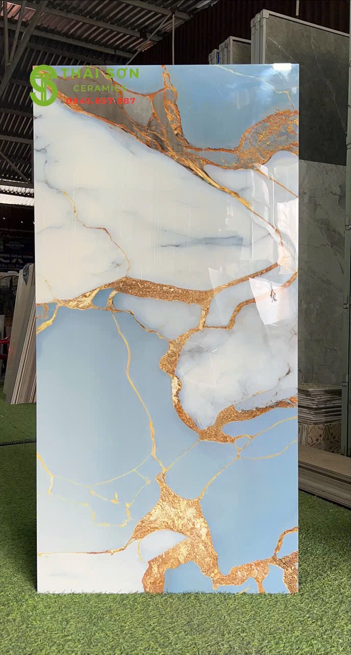 Gạch lát nền 60x120 siêu bóng màu xanh trắng chỉ vàng