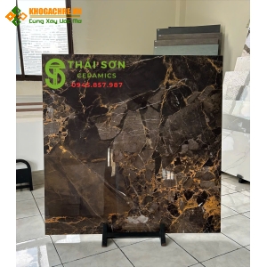Gạch trung quốc bóng kiếng 100x100 màu nâu vân vàng đồng