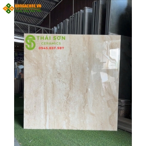 Gạch ấn độ 120x120 lát nền màu kem vân gỗ bóng kính